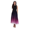 A woman modeling a sleeveless maxi dress with a black bodice and a pleated skirt featuring a dark-to-light ombré transition from black to purple and pink at the hem, shown against a plain white background.