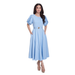 A woman modeling a light blue midi dress with puffed short sleeves, a matching waist belt with a gold-tone circular buckle, and side pockets, set against a plain white background.
