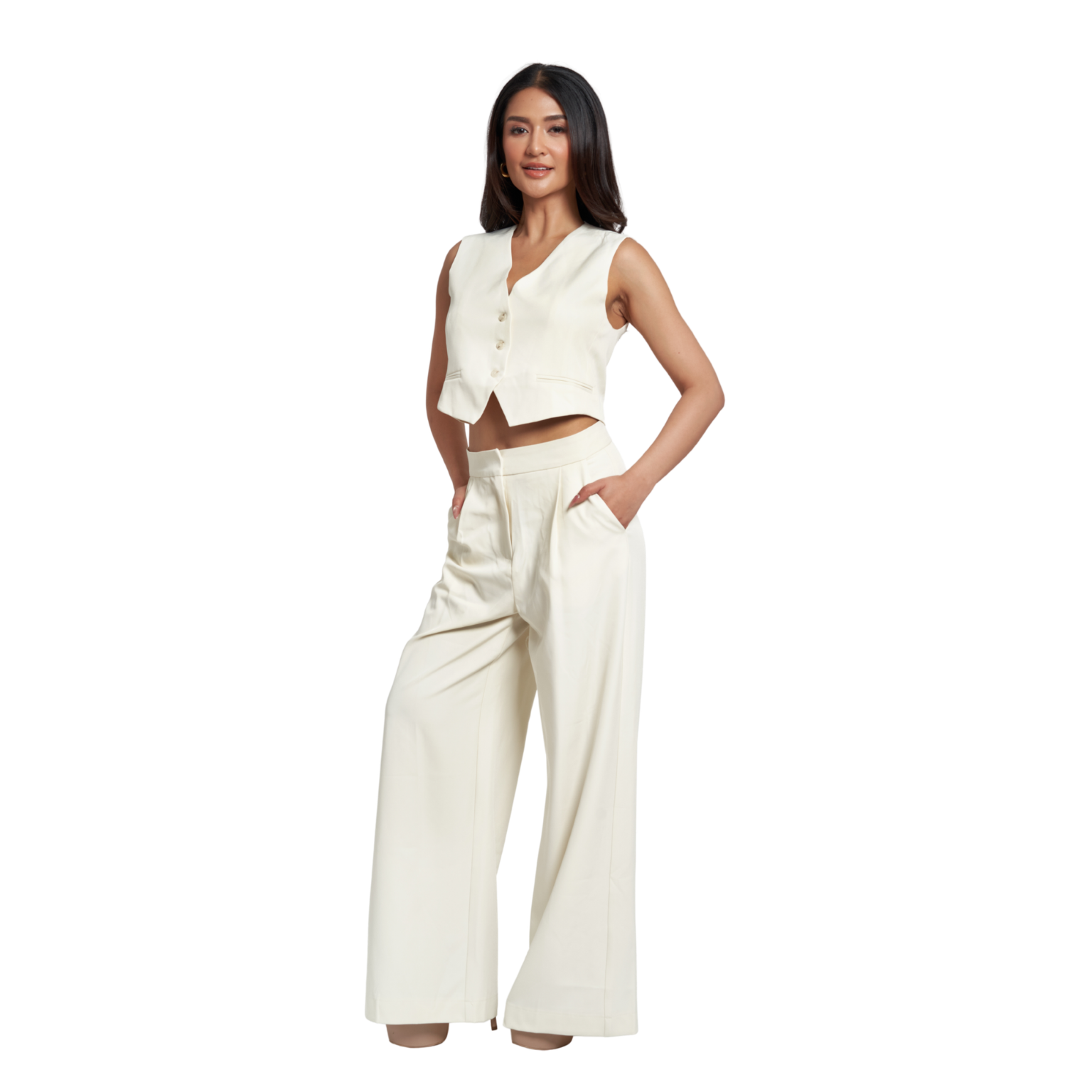 A woman modeling a matching off-white two-piece outfit consisting of a sleeveless cropped vest with front buttons and high-waisted wide-leg pants, set against a plain white background.