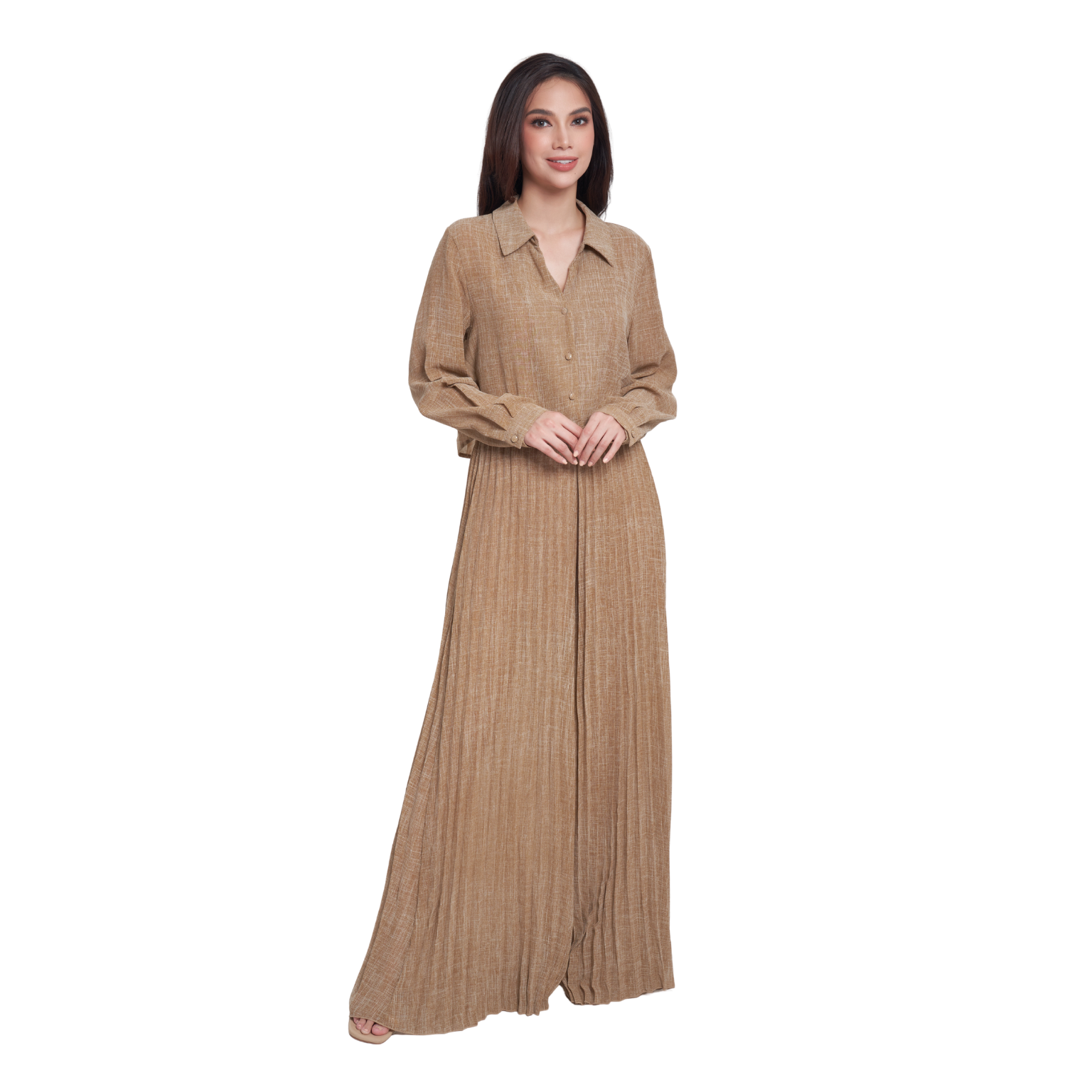 A woman modeling a long-sleeved, collared maxi dress in a warm tan or camel color with a textured vertical pleated pattern, set against a plain white background.