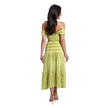 A woman viewed from the back wearing a light yellow-green off-the-shoulder midi dress with a textured, pleated skirt and a ruched bodice, paired with nude high-heeled sandals against a plain white background.