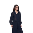 A woman modeling a dark navy blue sheer long-sleeve button-up shirt paired with matching pleated trousers, set against a plain white background.
