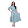A woman modeling a light blue midi dress with puffed short sleeves, a round neckline, and a matching waist belt with a gold buckle, set against a plain white background.